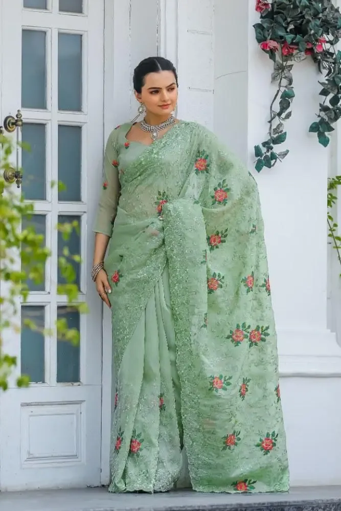 LUXURIOUS PURE CHIFFON SAREE WITH INTRICATE CUTWORK AND BUTTIS IN GREEN